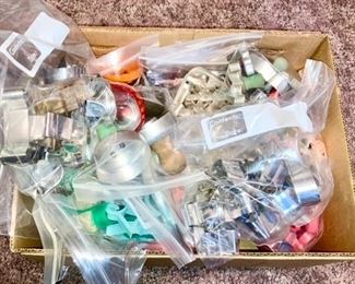 Many cookie cutters, (metal, plastic, wooden handle, etc)