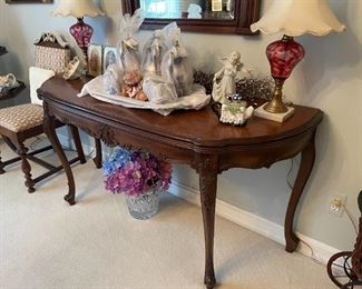 . . . this wall table is in the French Provincial style and is beautiful!