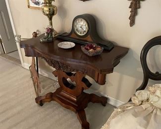 . .. a fantastic lamp table with lamp and mantle clock featuered