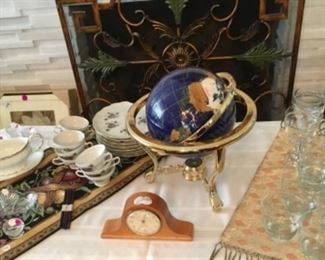 Miniature mantel clock with mechanical movement by Seth Thomas. Globe with inlaid semi-precious gemstones. 