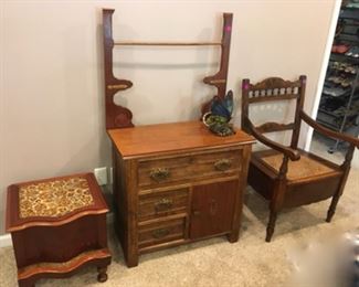 Antique commode with footrest (left). Antique washstand with towel rack, 3 drawers, 1 door. Antique commode chair.