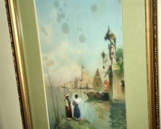 Attractive seascape with buildings, boats and women by Umberto Ogania (Italian, 1867-1942)