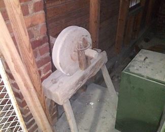 Plantation grinding stone on stand