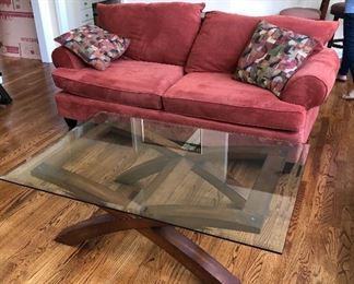 Plush sofa.                                                                                           
Glass and wood cocktail table.  Design matches kitchen table.