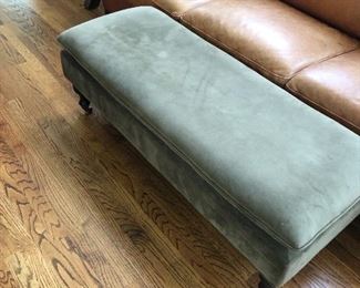 Large ottoman.  Top opens for storage.  (Leather sofa not available).