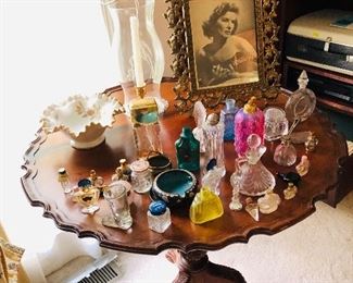 Pie crust table and collection of vintage perfume bottles