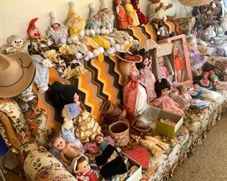 Dolls and clowns!! Vintage sofa too
