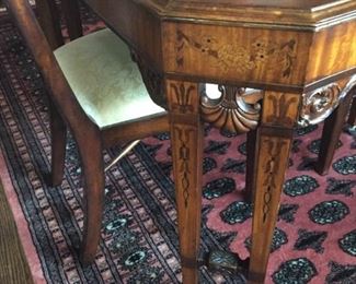 Beautiful dining room inlaid table (over 100 years old) with three chairs.
