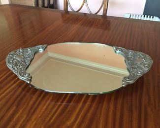 Silver edged vanity mirror.