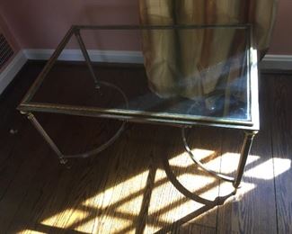 Glass topped metal table.