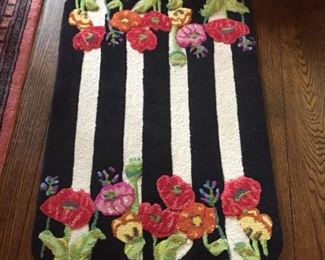 MacKenzie-Childs floral carpet.