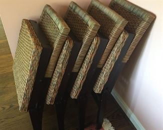 Set of four rattan folding chairs.