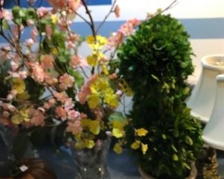 Nice selection of vases and planters with artificial flowers.