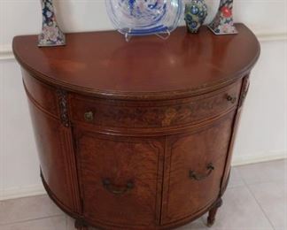 Entry table  by  Northern  furniture  Co  It  is  19"  deep and  36" in  length.