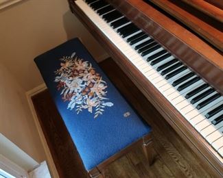 view  of  piano  bench  and  keys