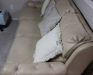 leather  3  cushion  sofa- it  is  36" deep  and  85"  long  the  price  is  250.00