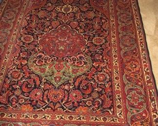 rug with reds 80" x 52"