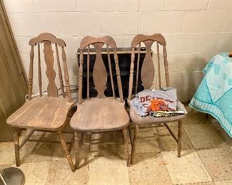 Three wood chairs.