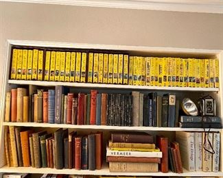 National Geographic VHS and magazines in storage boxes.