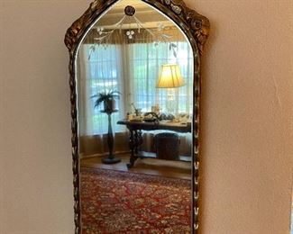 Beautiful etched antique wall mirror with basket of flowers frame.