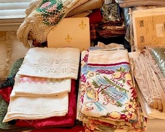 Vintage tablecloths and large doilies.