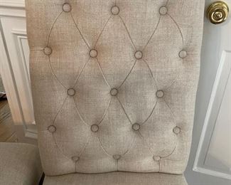 Two Restoration Hardware tufted back side chairs upholstered in oatmeal-color linen fabric. Photo 2 of 2