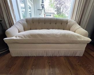 Edward Ferrell Loveseat with tufted back and fringe trim. Measures 68"W with 22" Seat Depth.