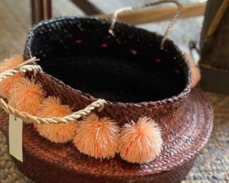 Woven Basket with Pom Poms.