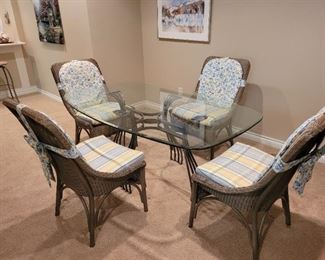 $350, Glass table with Metal base 72" x 42" x 30" and 4 wicker chairs - OR- Table $200, Wicker Chairs $50 each