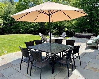 Cast Aluminum square table w/ 8 chairs and
Umbrella