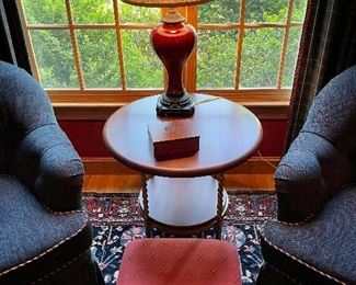 Square burgundy table lamp w/ beige shade 
Small foot stool w/ golf club fabric 
Round iron & wood 2 tier table 
