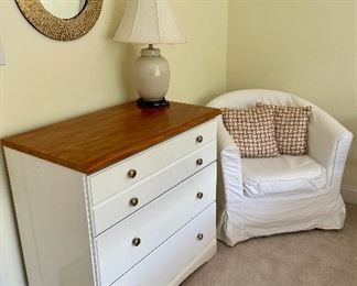 3 drawer white dresser w/ wood top by Childcraft

Ivory table lamp

IKEA slip covered chair 

Gold round mirror 