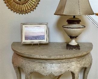 Round sunburst mirror
Curry & Co cracked & brass table shade 
Faux painted Demi table by Amy Howard 