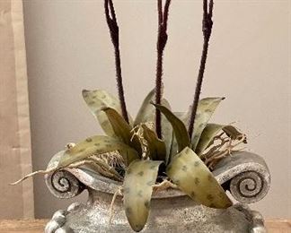 Red faux plant in vase