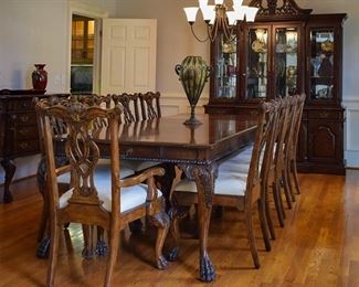 Beautiful dining table, two leaves, seats 10! Gorgeous claw-footed feet. Chairs carved on front and back.