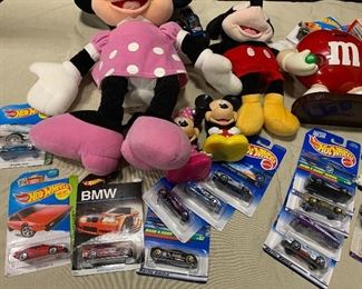 Mix of stuffed animals and Hot Wheels
