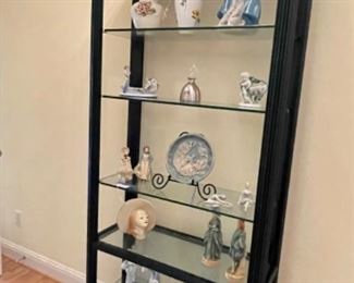 tall bookcase with glass shelves, Victorian figurines
