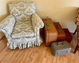 green toile chair, several pieces of vintage suitcases