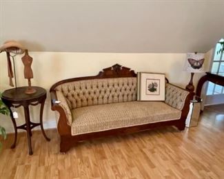 Eastlake small sofa in excellent condition, artwork, antique side table, mirrored end table
