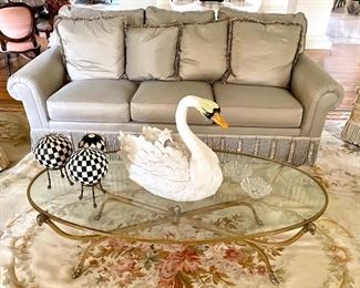 Henredon sofa with tassels, Hollywood regency brass coffee table, large swan (Italy?) 