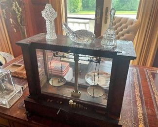 antique brass scales, Waterford paperweights,