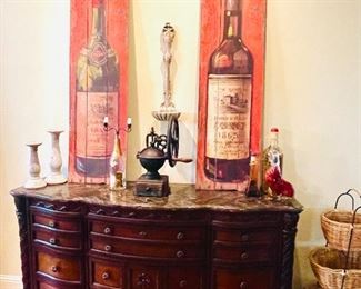 marble top ornate ornate sideboard, antique coffee grinder, pair of wine bottle art work pieces, stand with 3 baskets