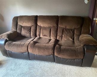 Power reclining leather/fabric sofa