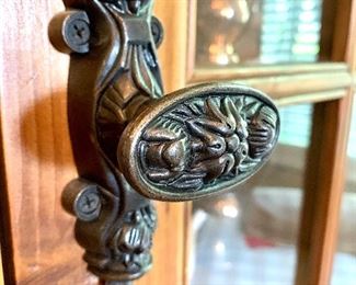 Close-up of hardware on “Chorus Theory” cabinet.