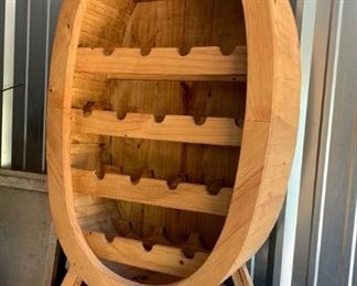 Large wine rack made from wine barrel. Footed. Stands 45" tall. Great condition and super cool. $95