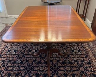 $300.00  Mahogany Dining Table with Pedestal and Claw Bases.  Beautiful Inlay and Ebony banding.  2 leaves additional.  Minor surface imperfections,  one leaf has a large scratch.  43" x 64" x 29" +24"  Solid Wood.