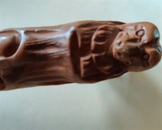 carved handle on one of the parasols