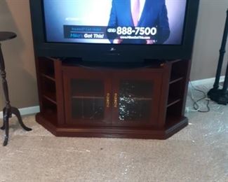 60-inch Zenith flatscreen older model with tv console 64 inches  in height, 5 foot across and 2 foot deep