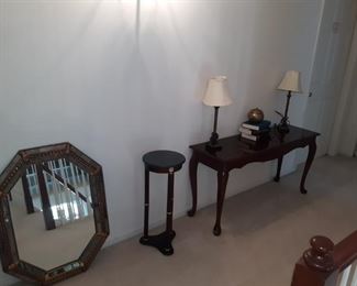 Sofa table and decorative mirror plus plant stand