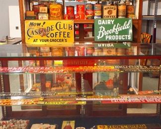 Country store cans, tins, advertising signs, sheep figurines, circus pamphlets, etc